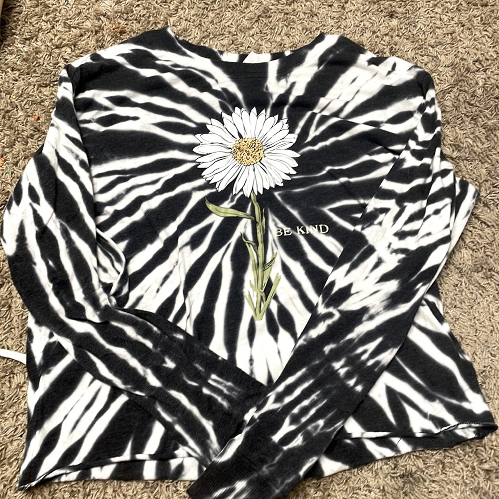 I only wore it a handful of times. It is a cropped long sleeve.